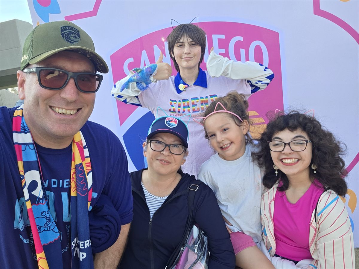 Family photo at a San Diego Wave match